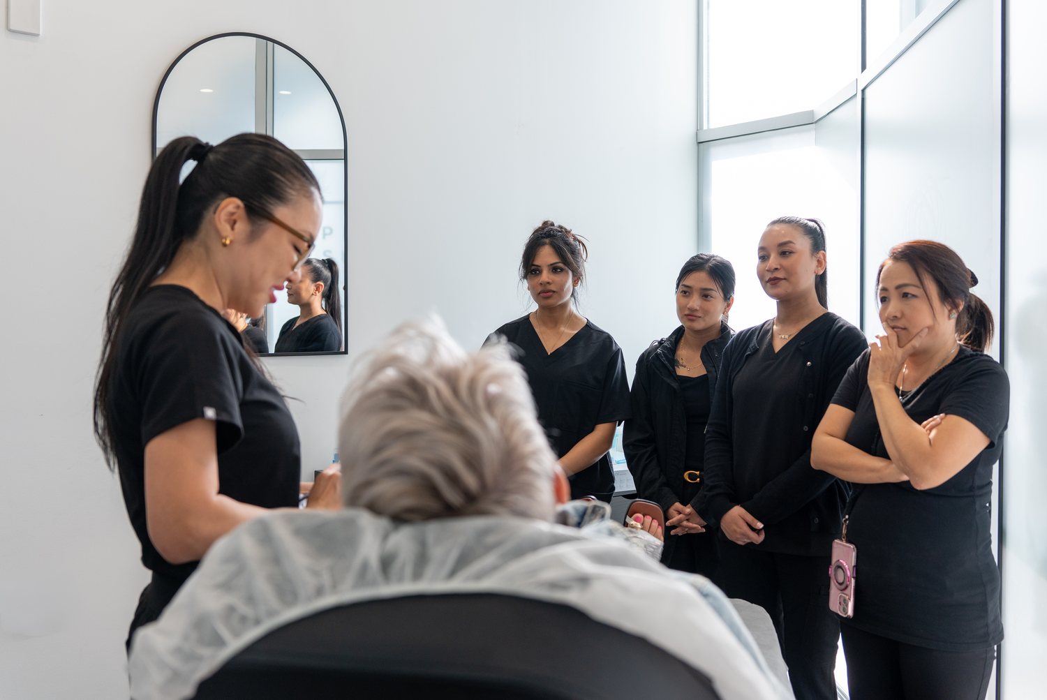 Supervising practitioner guiding the clinical team through a treatment at an ACC clinic